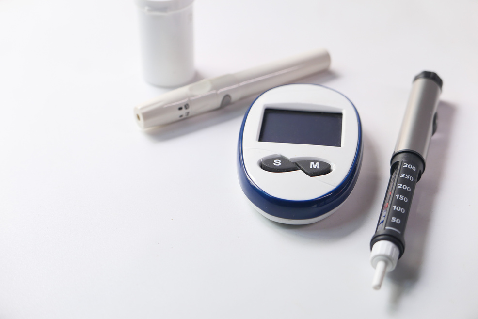 Diabetic Measurement Tools and Insulin Pen on Table